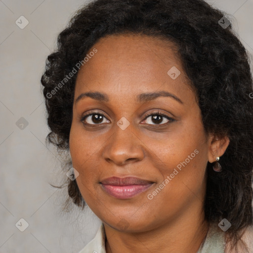 Joyful black young-adult female with long  brown hair and brown eyes