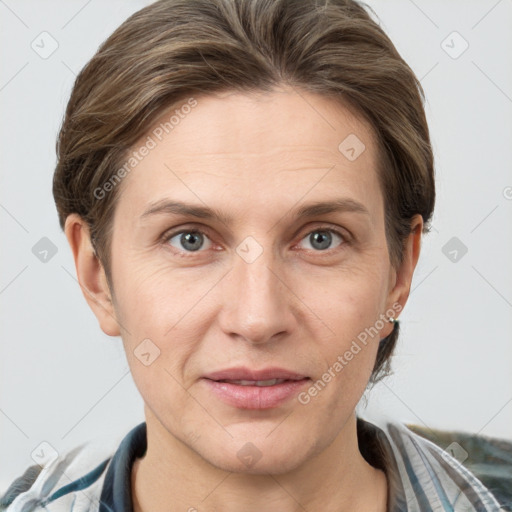 Joyful white adult female with short  brown hair and grey eyes