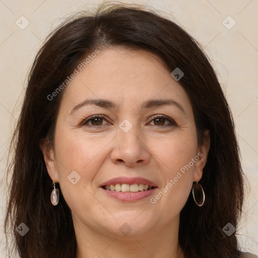 Joyful white adult female with long  brown hair and brown eyes