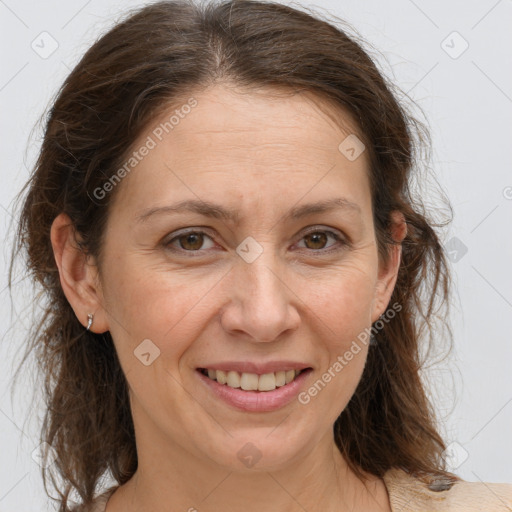 Joyful white adult female with medium  brown hair and brown eyes