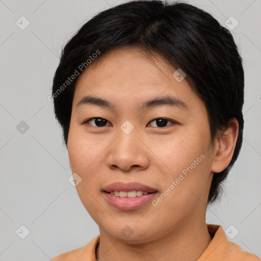 Joyful asian young-adult female with short  brown hair and brown eyes