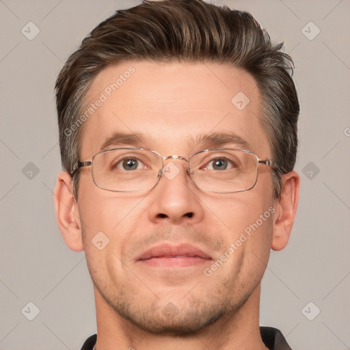 Joyful white adult male with short  brown hair and brown eyes