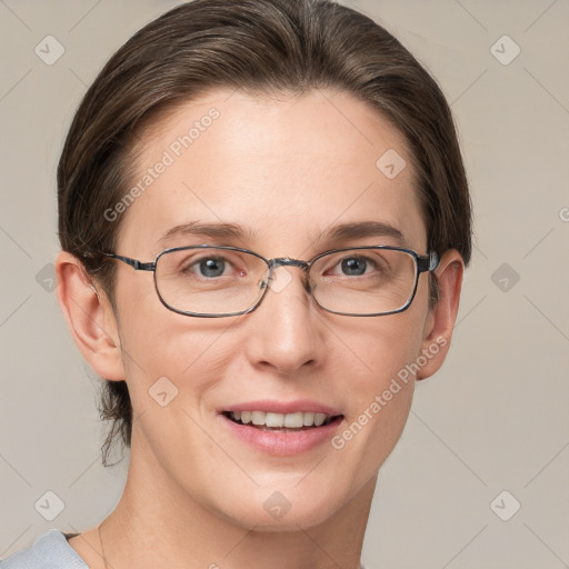 Joyful white adult female with short  brown hair and grey eyes