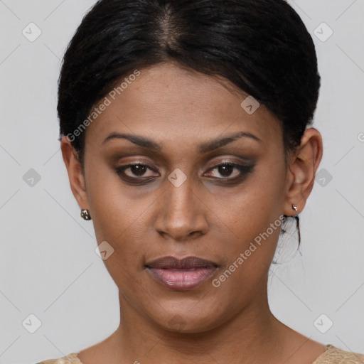 Joyful black young-adult female with short  brown hair and brown eyes