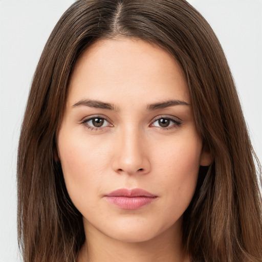 Neutral white young-adult female with long  brown hair and brown eyes