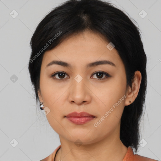 Joyful latino young-adult female with medium  black hair and brown eyes