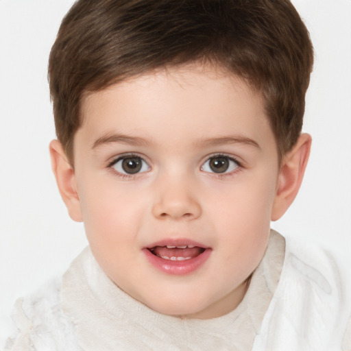 Joyful white child male with short  brown hair and brown eyes