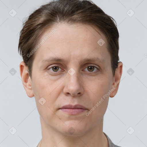 Joyful white adult female with short  brown hair and grey eyes