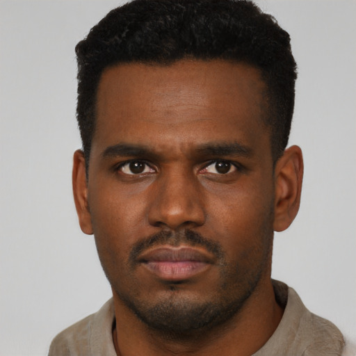 Neutral black young-adult male with short  black hair and brown eyes