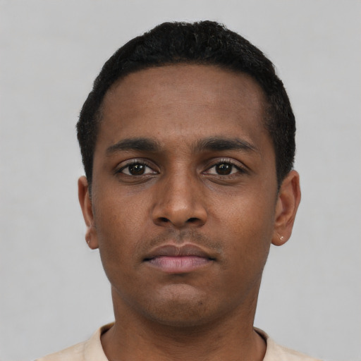 Neutral black young-adult male with short  black hair and brown eyes