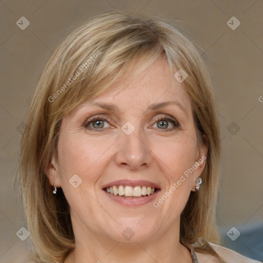 Joyful white adult female with medium  brown hair and grey eyes