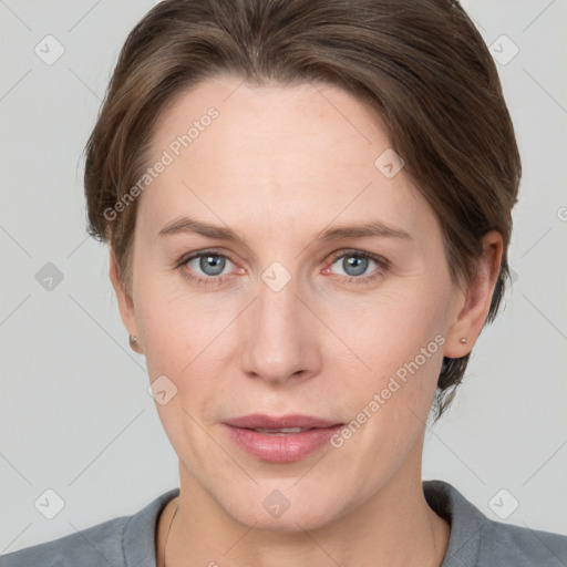 Joyful white adult female with medium  brown hair and grey eyes