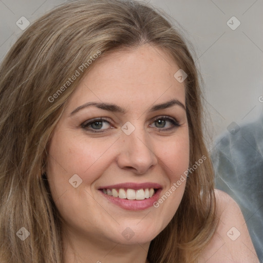 Joyful white young-adult female with long  brown hair and brown eyes