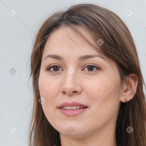 Joyful white young-adult female with long  brown hair and grey eyes