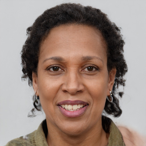 Joyful latino adult female with short  brown hair and brown eyes