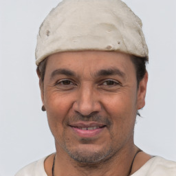 Joyful white adult male with short  black hair and brown eyes