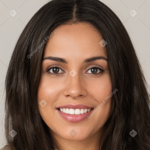 Joyful white young-adult female with long  brown hair and brown eyes