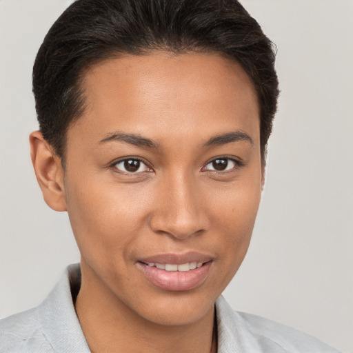 Joyful white young-adult female with short  brown hair and brown eyes