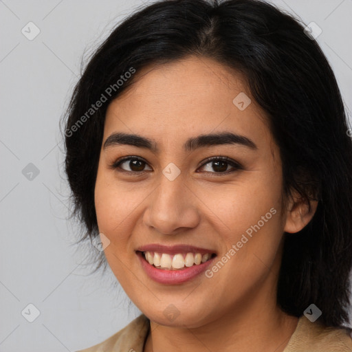 Joyful latino young-adult female with long  brown hair and brown eyes