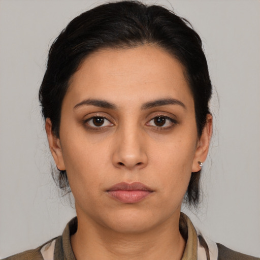 Neutral latino young-adult female with medium  black hair and brown eyes