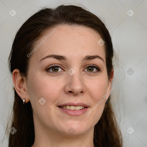 Joyful white young-adult female with long  brown hair and green eyes