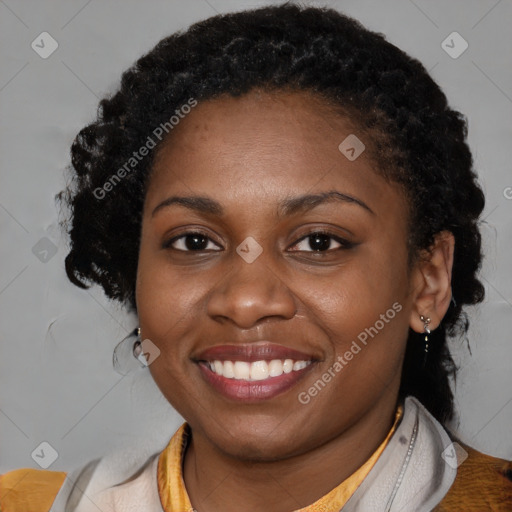 Joyful black young-adult female with medium  black hair and brown eyes