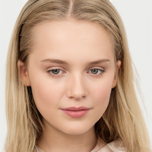 Joyful white child female with long  brown hair and brown eyes