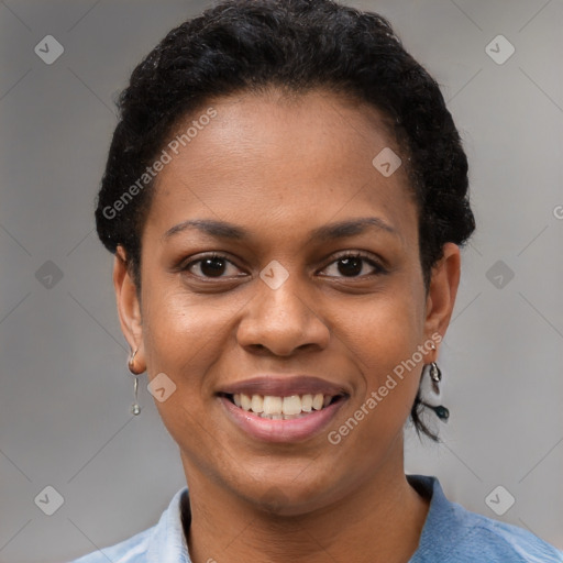 Joyful black young-adult female with short  brown hair and brown eyes