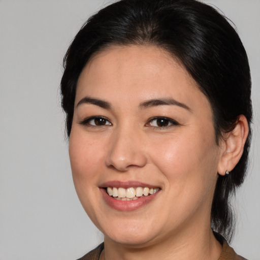 Joyful white young-adult female with medium  brown hair and brown eyes