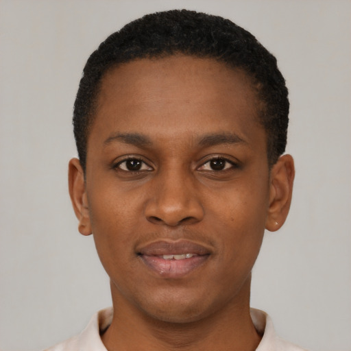 Joyful black young-adult male with short  black hair and brown eyes