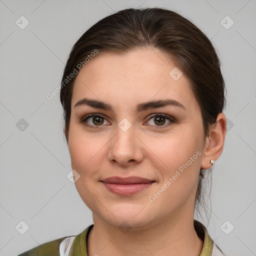 Joyful white young-adult female with medium  brown hair and grey eyes