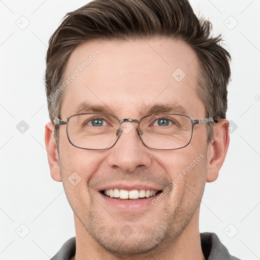 Joyful white adult male with short  brown hair and grey eyes