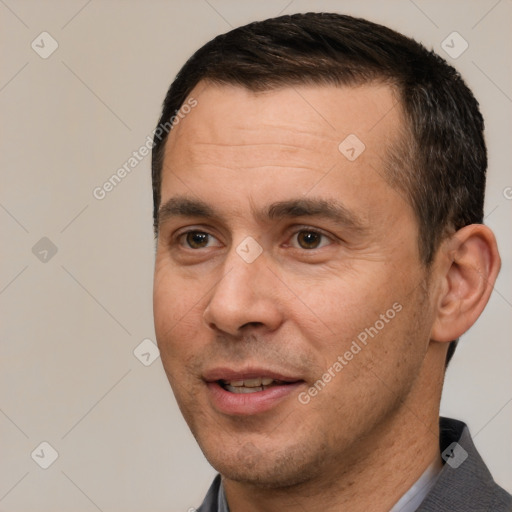 Joyful white adult male with short  brown hair and brown eyes