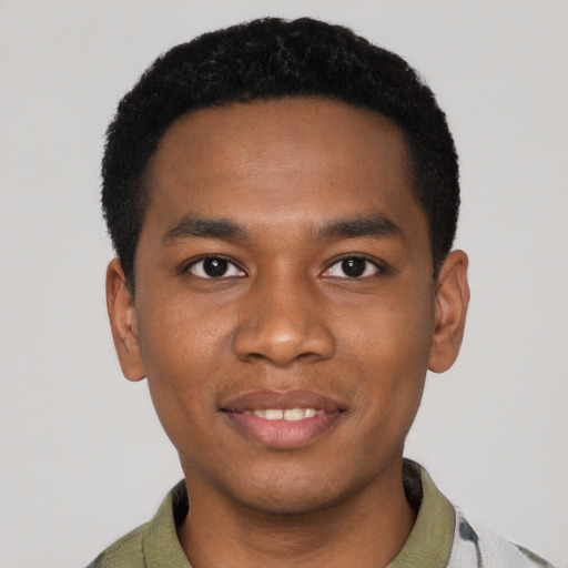 Joyful black young-adult male with short  black hair and brown eyes