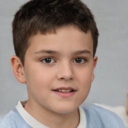 Joyful white child male with short  brown hair and brown eyes