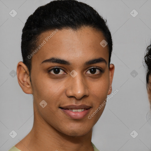 Joyful latino young-adult male with short  brown hair and brown eyes