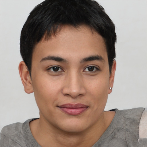 Joyful asian young-adult male with short  brown hair and brown eyes