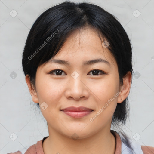 Joyful asian young-adult female with medium  black hair and brown eyes