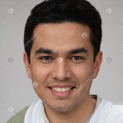 Joyful white young-adult male with short  black hair and brown eyes