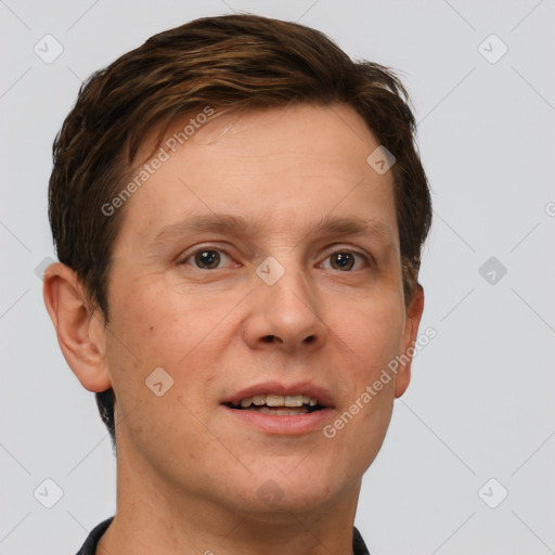 Joyful white adult male with short  brown hair and grey eyes