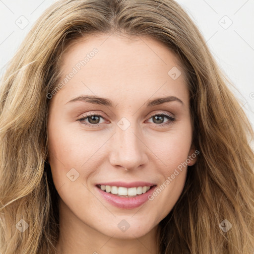 Joyful white young-adult female with long  brown hair and green eyes