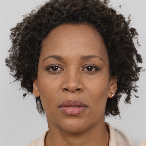Neutral black adult female with short  brown hair and brown eyes