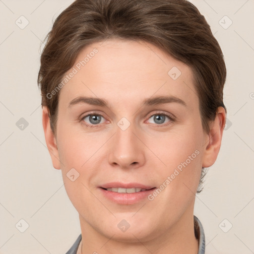 Joyful white young-adult female with short  brown hair and grey eyes