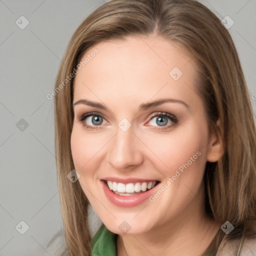 Joyful white young-adult female with long  brown hair and blue eyes