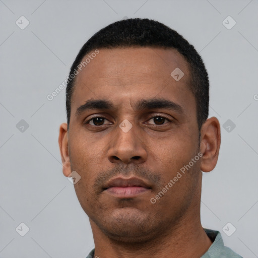 Neutral latino young-adult male with short  black hair and brown eyes