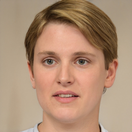 Joyful white young-adult female with short  brown hair and green eyes