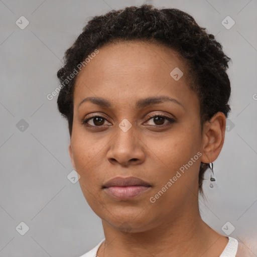 Neutral black young-adult female with short  brown hair and brown eyes