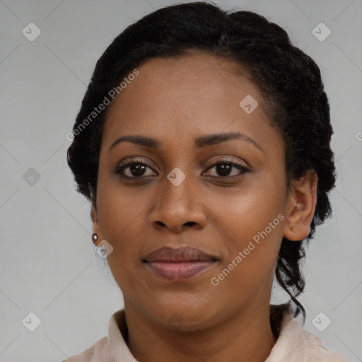 Joyful black young-adult female with medium  brown hair and brown eyes