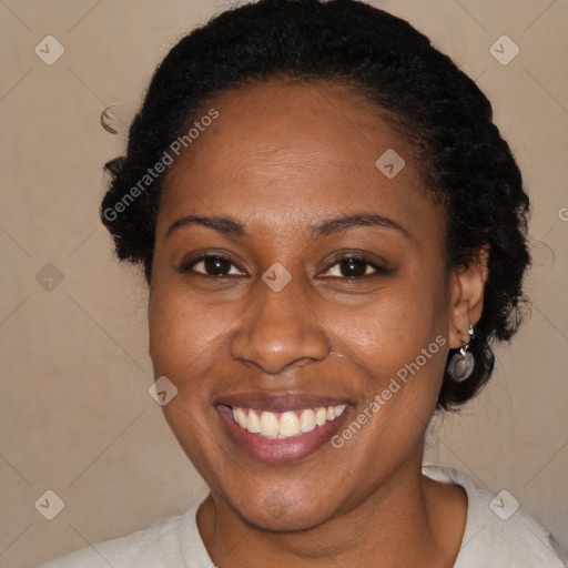 Joyful black adult female with short  brown hair and brown eyes