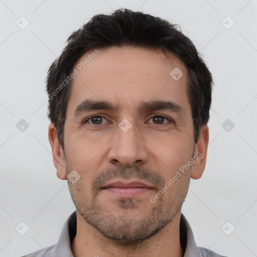 Neutral white adult male with short  black hair and brown eyes